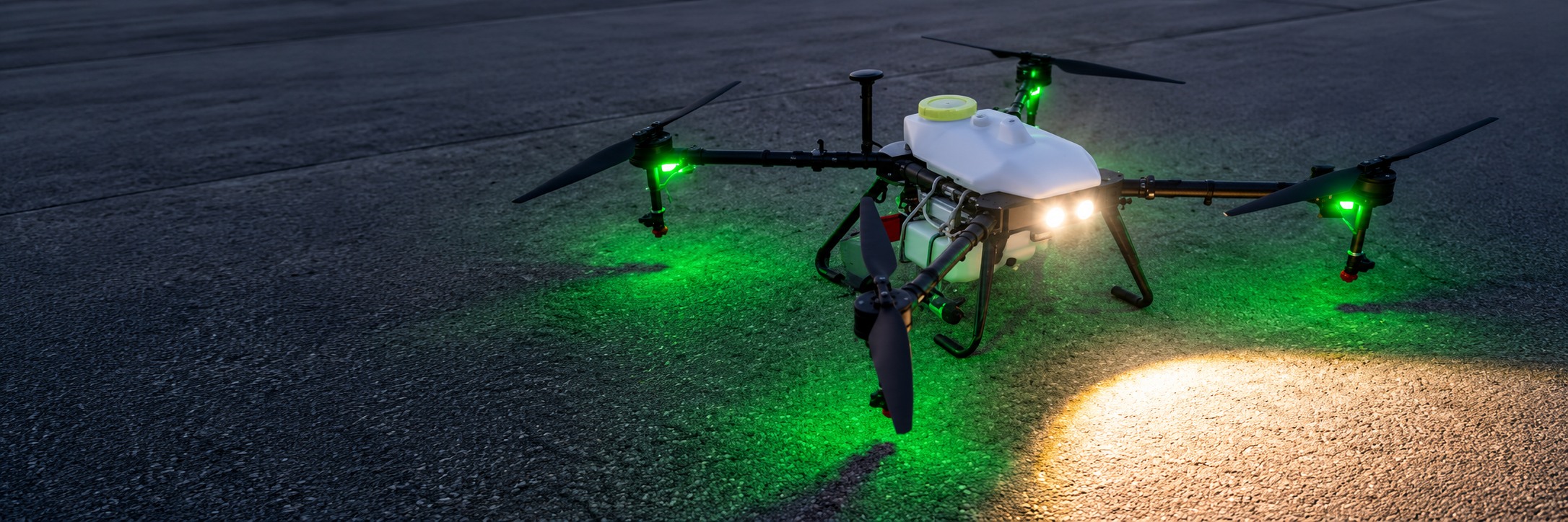 Industrial drone with navigation lights and integrated spotlight